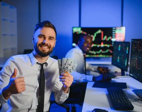 User holding cash in front of trading screens while using PryLuxo